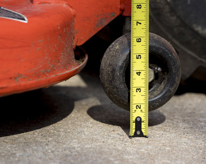Measuring the height of a mower deck