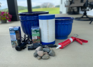 Materials required for a DIY water fountain grouped together for a picture