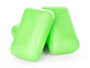 Three bars of green soap on white background